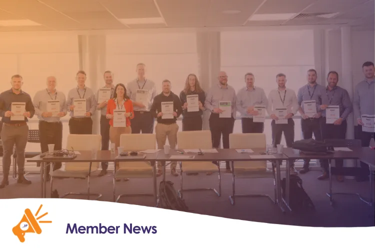 A group of people holding certificates