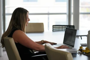 A woman working on a laptop