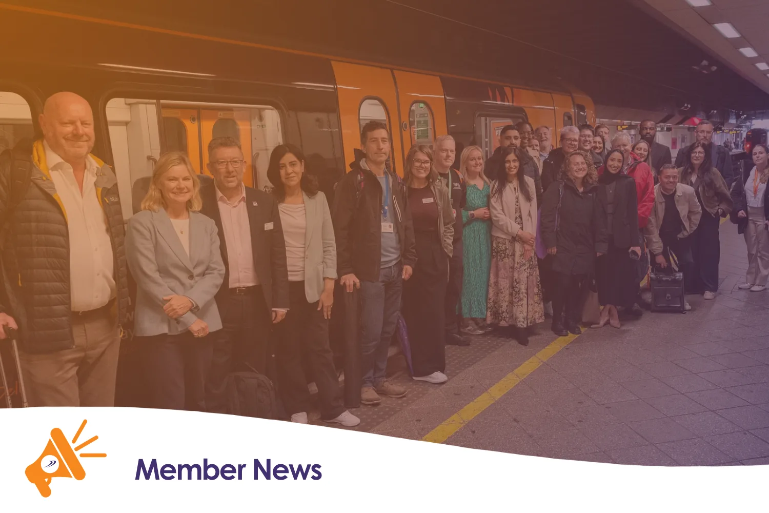 A group of people stood in front of train