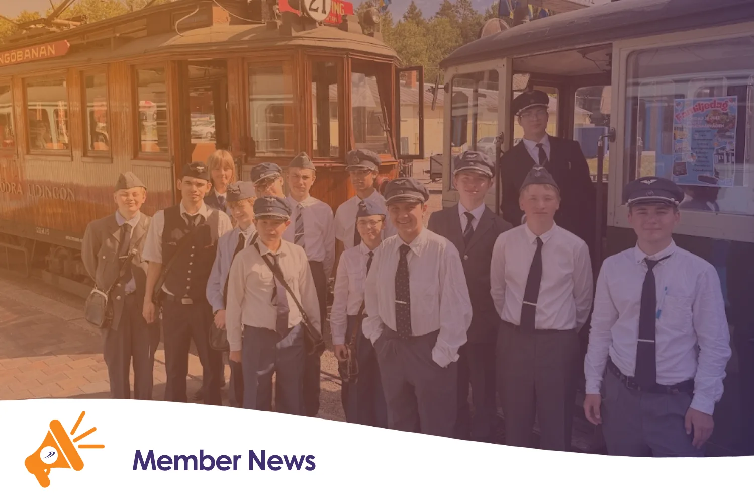 A group of people next to two trams