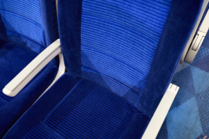 A close up photo of a train seat